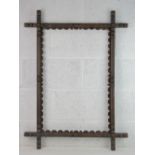 19 th C Folkart Oxford Frame - a chamfered stained oak and stained pine frame with half sphere and