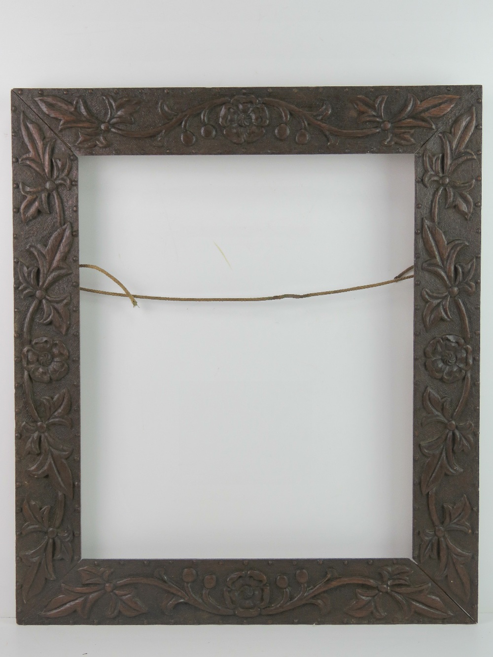 Victorian Carved Frame - a Walnut carved Foliate and Rose with Dimple borders decorated Frame (2