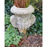 A pre-cast stone urn of Classical style, 25" high.