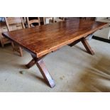 A 20th century oak kitchen table raised over X shaped supports, 6ft 6" x 3ft (198 x 91cm).