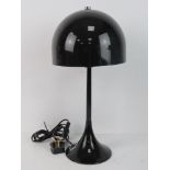 A retro 1970's style table lamp with sha