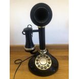 A contemporary 'candlestick' telephone a