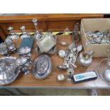 A large quantity of silver plated items including pair of candlesticks, tureens, toast rack,