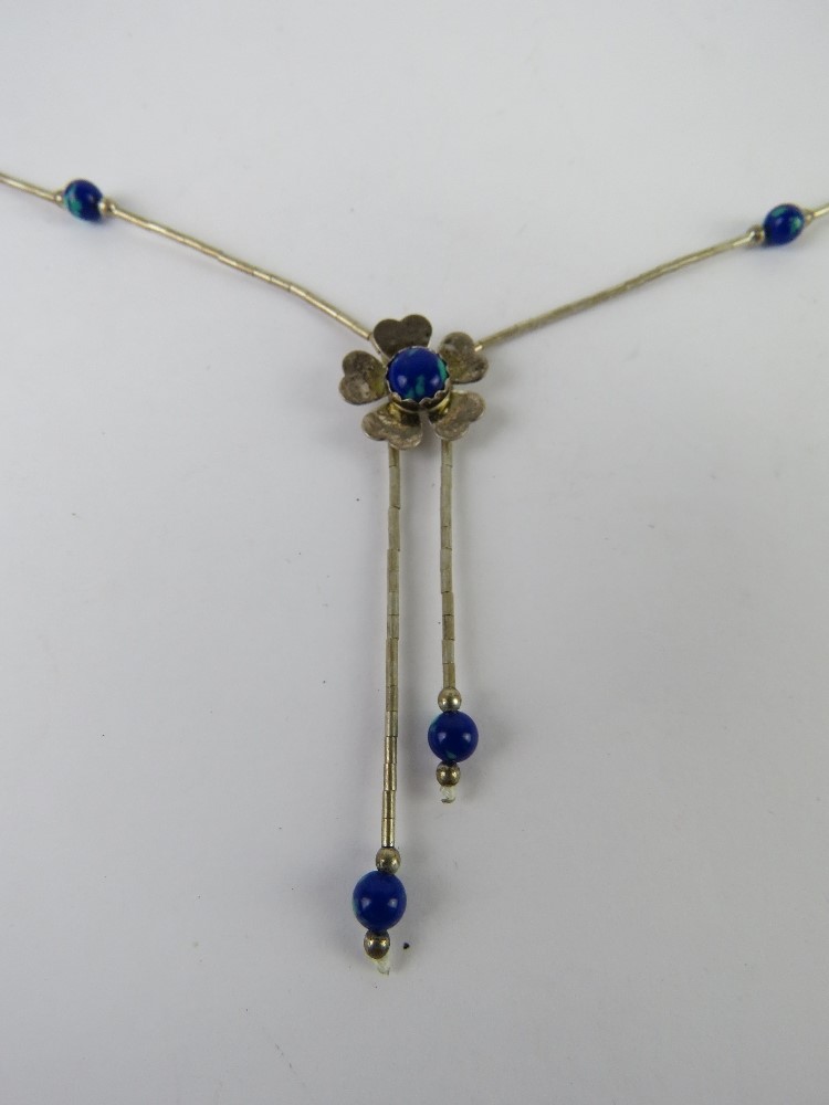 A Native American style silver beaded necklace having blue stone set floral design, marked Sterling. - Image 2 of 3