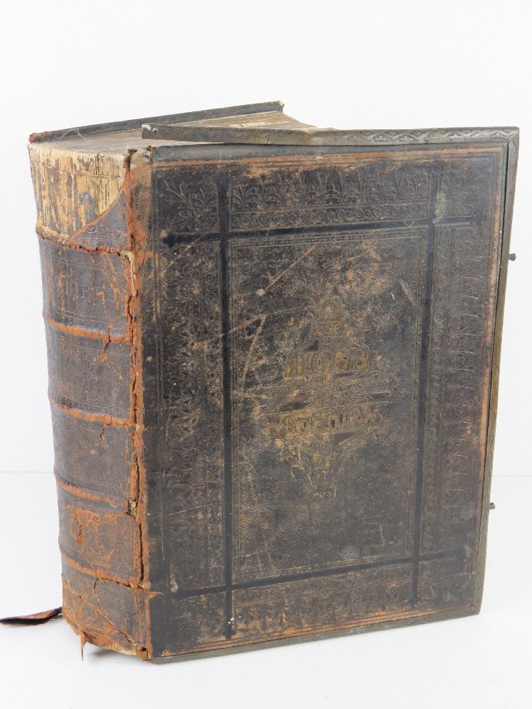 A leather bound bible with marginal reading and parallel references and the commentaries of Henry