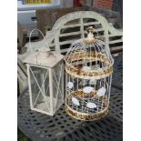 A white painted 'bird cage' and a large white painted lantern.