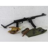 A deactivated PPS-43 SMG with three spare magazines, mag pouch, Cleaning rod, and Oil bottle.