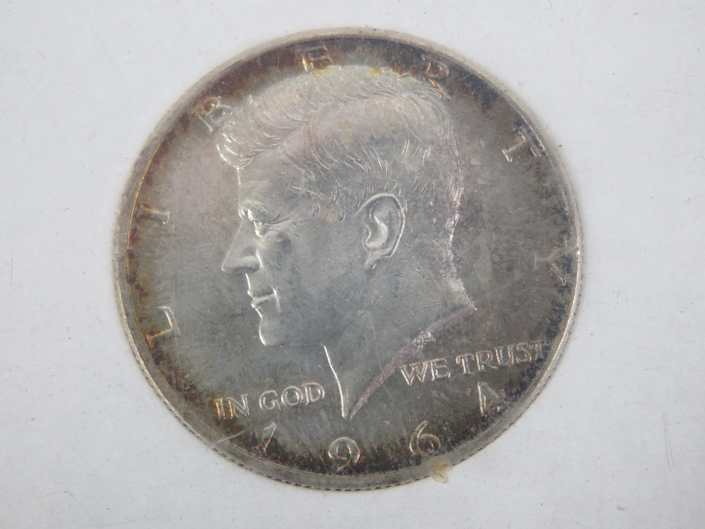 A John Fitzgerald Kennedy (JFK) 1917-1963 commemorative 1964 half dollar coin.