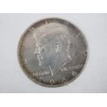 A John Fitzgerald Kennedy (JFK) 1917-1963 commemorative 1964 half dollar coin.