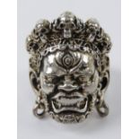 An Asian Death God ring having skull crown, stamped 925, size T (slightly adjustable) 20.7g.