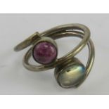 A silver and hardstone ring having garnet in matrix and moonstone?, stamped 925, size L-M.