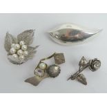 A sterling silver and pearl floral brooch together with a HM silver floral brooch and two 925