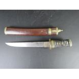An antique Japanese Tanto with cord-covered tsuka, brass and silver fuchi and kashera,