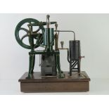 A Rider-Ericsson precision vertical hot air pumping engine having 9" spoked fly wheel,