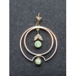 A 9ct gold late Victorian early Edwardian peridot and seed pearl pendant, stamped 9c.