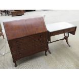 A half veneered mahogany fall front bureau, lid opening to reveal various compartments within,