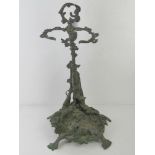 A cast brass stick stand in hunting theme having hound to front, gun and hare to back,