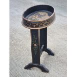 A hand painted and ebonised oval occasional table, 50 x 32cm approx.