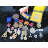 A pair of miniature WWI medals being War and Peace medals with ribbons on bar,