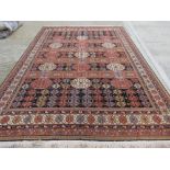 A large woolen rug, 380 x 270cm.