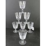 A set of seven crystal wine glasses having maker's mark to base.