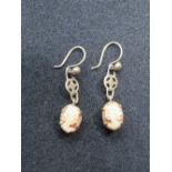 A pair of 9ct gold carved shell cameo earrings.