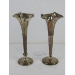 A matched pair of HM silver bud vases each standing approx 17cm high.