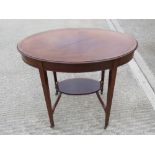 A delightful Edwardian oval planter table, crossbanded and strung with boxwood,