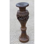 A contemporary carved wooden planter of Indo Asian influence, 90cm high.