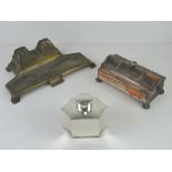 An Art deco desk standish having two inkwells over pen tray,
