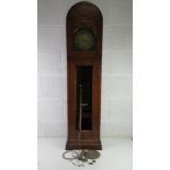 A mahogany cased Grandmother clock having brass dial, a/f one weight and part of movement in base,