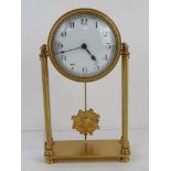 A brass mantel clock having white enamel dial with blue steel hands with pendulum,
