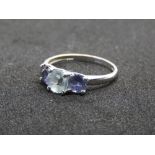 A 9ct white gold Aquamarine and iolite trilogy ring, hallmarked 375, size P, 2.1g.