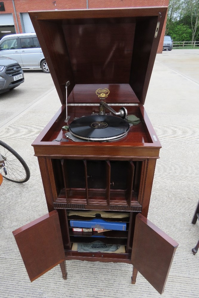 A superb Edwardian Columbia Grafonola, lid lifting to reveal wind up gramaphone apparatus within,