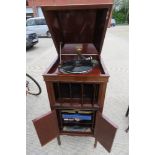 A superb Edwardian Columbia Grafonola, lid lifting to reveal wind up gramaphone apparatus within,