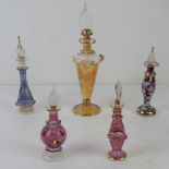 Five handmade glass scent bottles.
