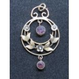 A late Victorian early Edwardian 9ct gold amethyst and seed pearl pendant, stamped 9ct.