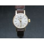 A 9ct gold ladies Longines wristwatch having silvered dial, dial,