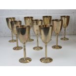 A set of contemporary brass goblets, each standing 18.5cm high.