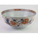 A large blue glazed punchbowl having Chinese floral and exotic bird decoration upon,