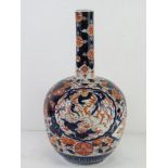 A large vase in reds and blues having floral Chinese decoration upon, all standing approx 37cm high.