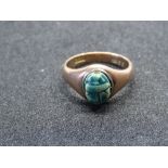 A 9ct rose gold signet ring set with a stone carved scarab beetle, hallmarked 375, size M, 4.