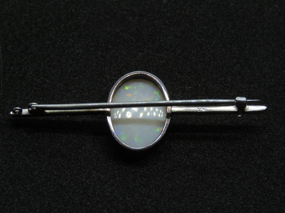 A 9ct white gold opal brooch, the large central oval cabachon approx 16 x 11mm, - Image 2 of 2