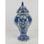 A blue and white ginger jar standing approx 33cm high having blue glaze, slightly a/f.