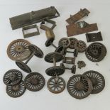 A quantity of assorted 2 1/2" and other live model steam railway wheels and parts.