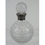 A cut glass decanter having HM silver collar marked for Birmingham.