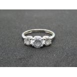 A 15ct white gold trilogy ring, three graduated white 'Diamonique' stones, hallmarked 585,