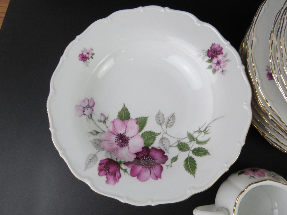 A white ground dinner service decorated with lilac and purple flowers, includes dinner plates, - Image 3 of 3