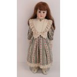 A handmade 20th century bisque headed doll made using an antique doll mould,