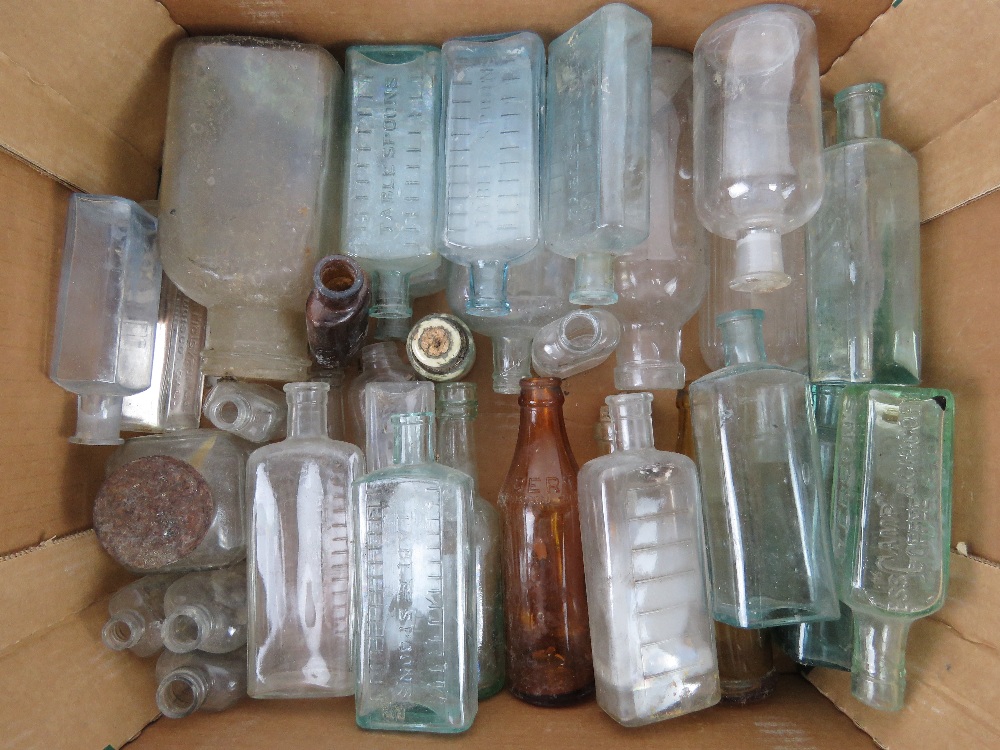 A quantity of vintage glass bottles inc poison bottles, Paterson's bottles,